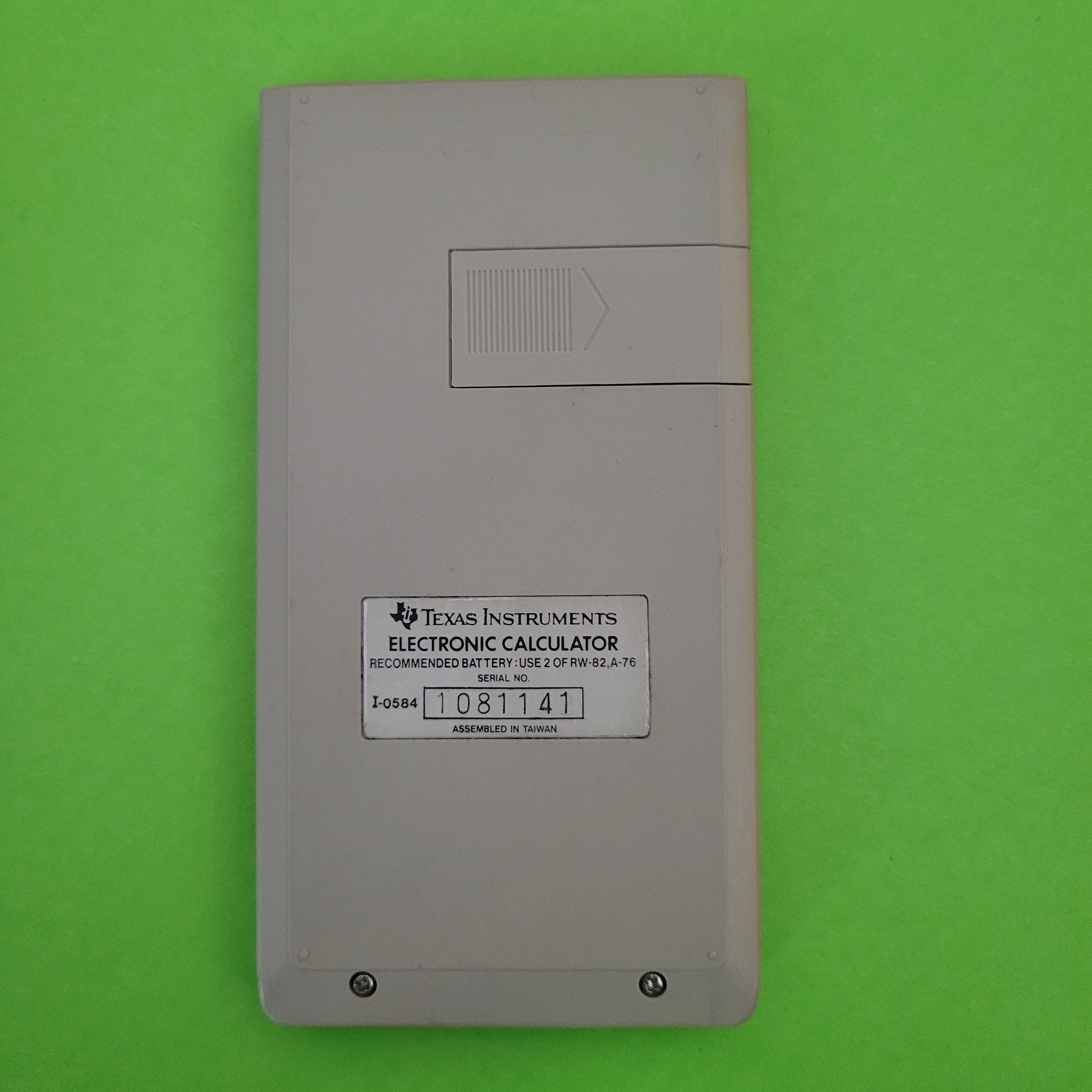 An image of the back of a texas instruments ti30iii scientific/engineering calculator